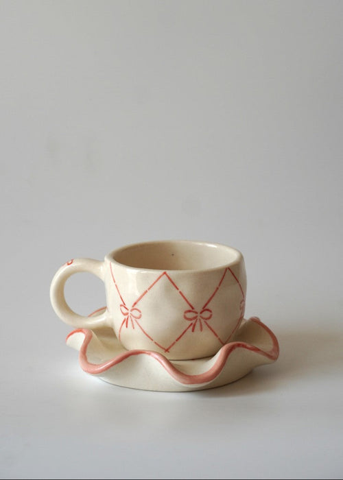 handpainted Bow mug with a saucer