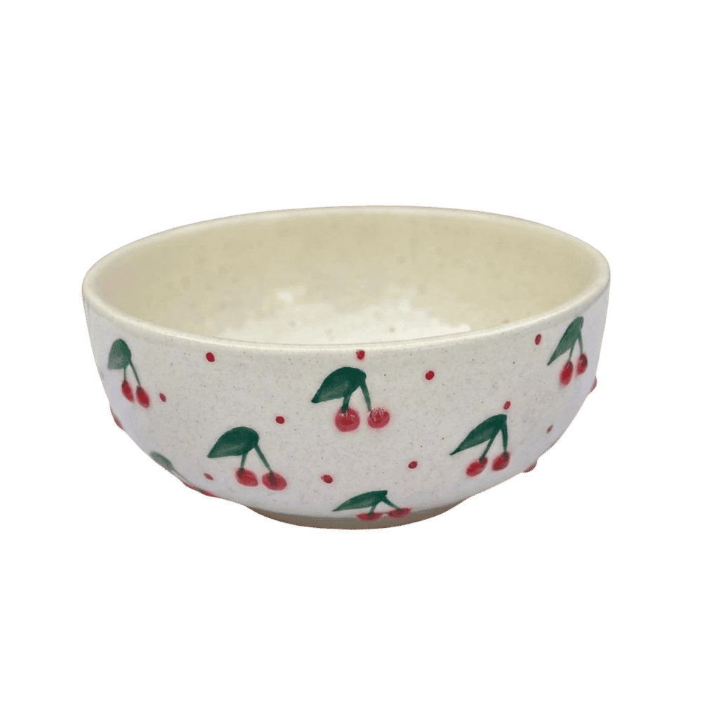 Ceramic bowl with cherry pattern on a white background