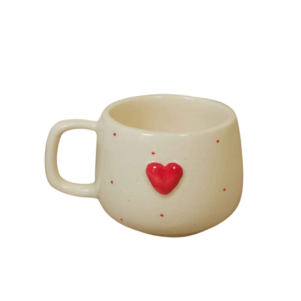 White ceramic mug with a red heart on a transparent background