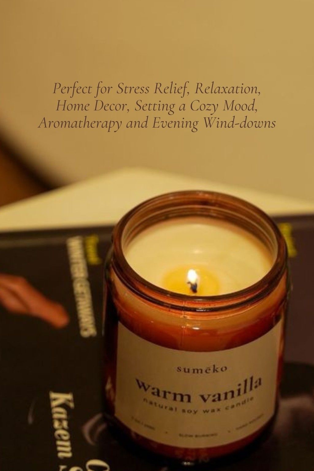 Candle labeled 'warm vanilla' with a blurred background